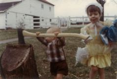 Eric Gina chopping wood c 1969